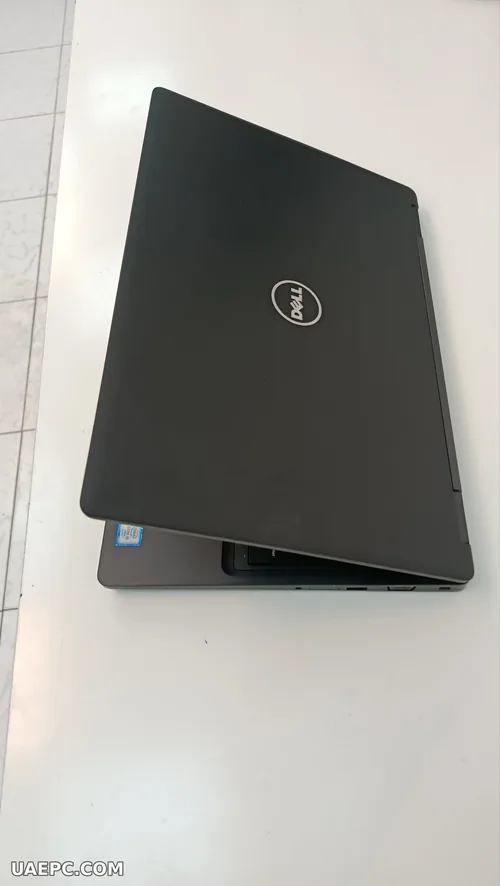 Second-hand business laptops stacked for a bulk order — B2B wholesale, Sharjah UAE