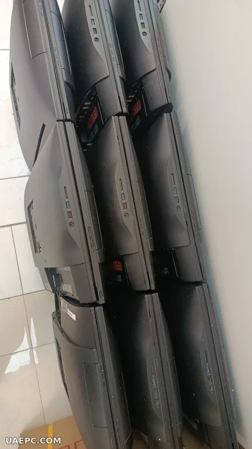 Second-hand all-in-one PCs stacked for a bulk order — B2B wholesale, Sharjah UAE