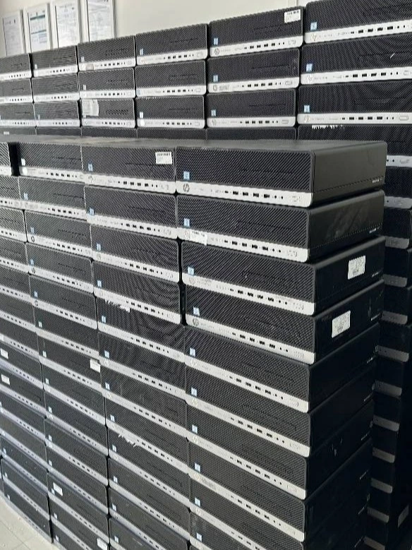 Rows of used HP 600 and 800 G4 mini cases stacked at the UAEPC showroom