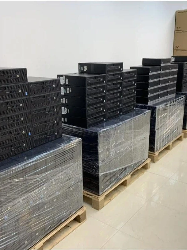 Shrink-wrapped pallets of HP mini cases ready for bulk shipping from Sharjah